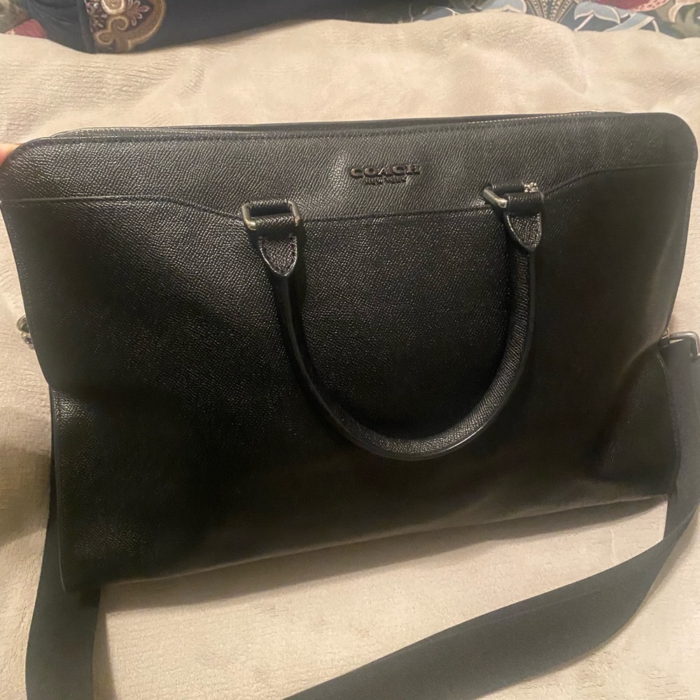 Coach briefcase. Posed w/purse pillow to demonstrate shape. Used once. No marks.